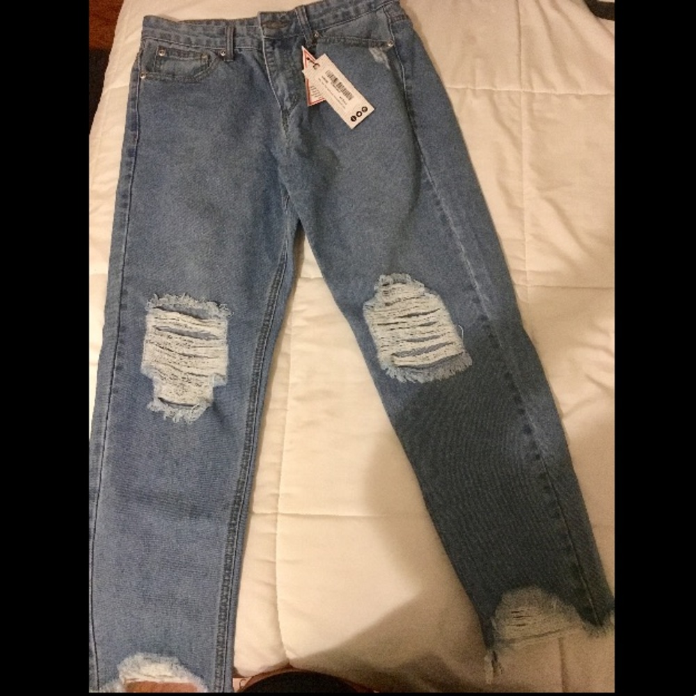 Boohoo brand ripped jeans, medium wash.